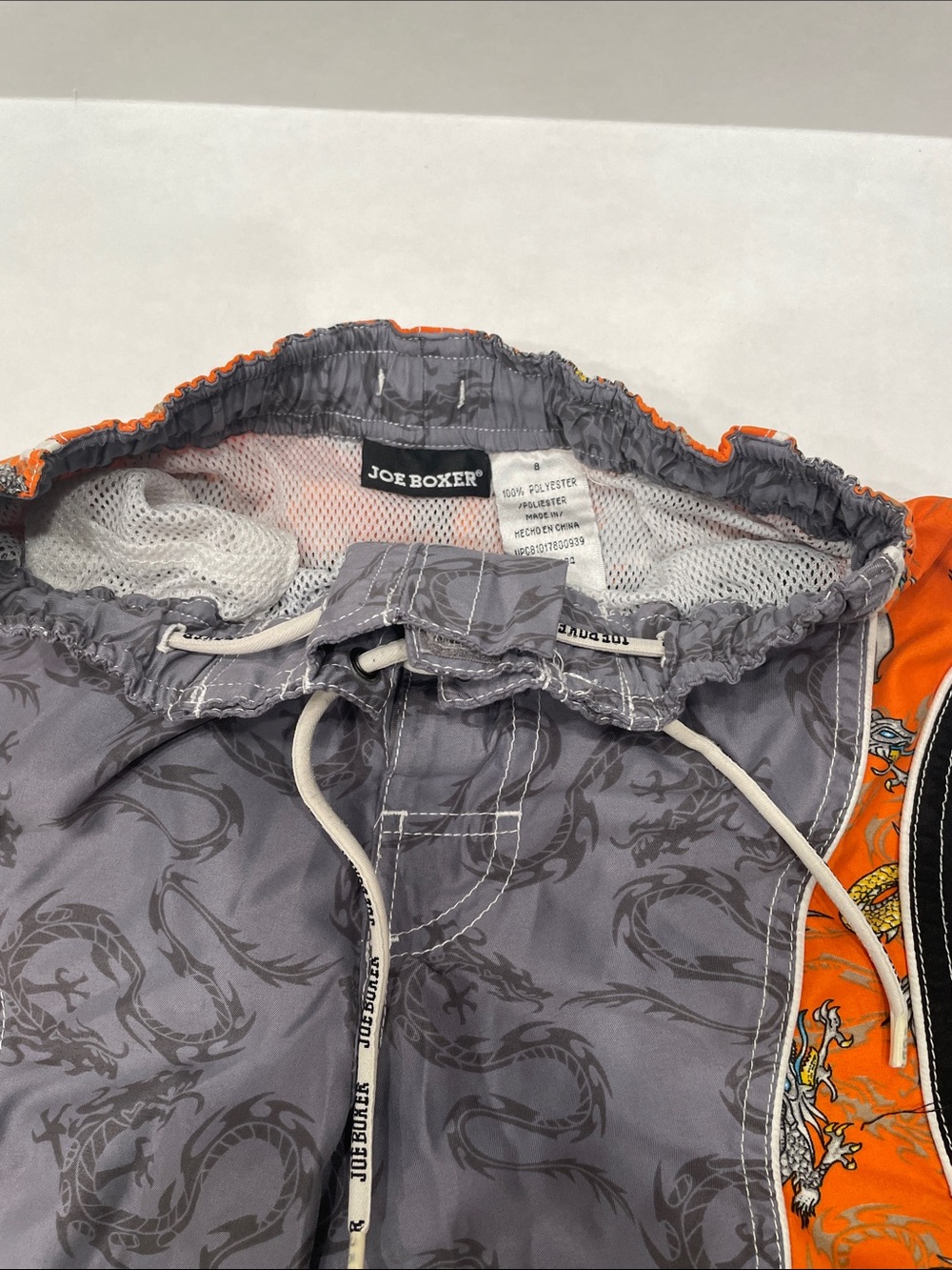 Kids Joe Boxer Gray Swim Trunks with Orange Side Panels and Dragon Print